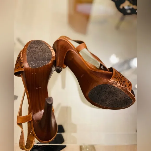 Diane VF Leather and wood high heels with laser cut details. Barely worn.