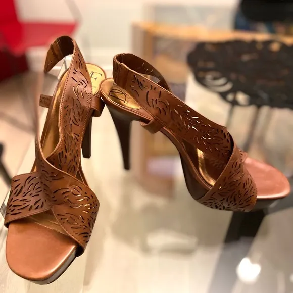 Diane VF Leather and wood high heels with laser cut details. Barely worn.