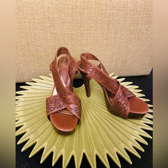 Diane VF Leather and wood high heels with laser cut details. Barely worn.