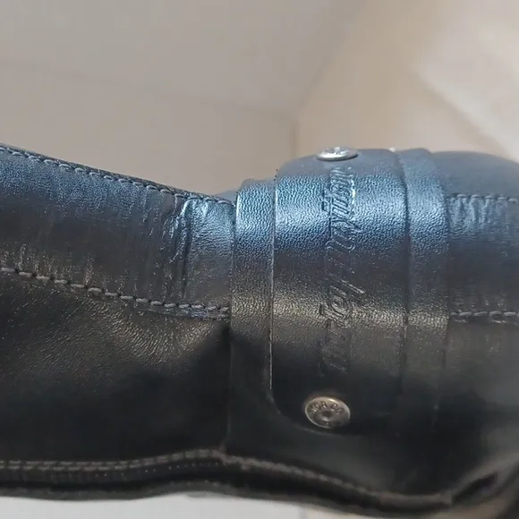 Harley Davidson calf heigth, 3.5 in heeled boots Sz 7 with a pewter belt accent.