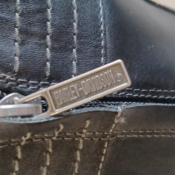 Harley Davidson calf heigth, 3.5 in heeled boots Sz 7 with a pewter belt accent.