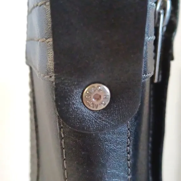 Harley Davidson calf heigth, 3.5 in heeled boots Sz 7 with a pewter belt accent.