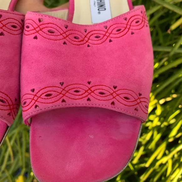 Moschino slides women Fuchsia leather hearts and Stitch logo detail shoes.