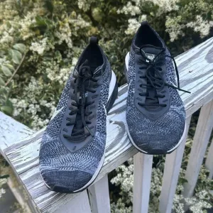Nike air Flyknit black and white athletic shoes