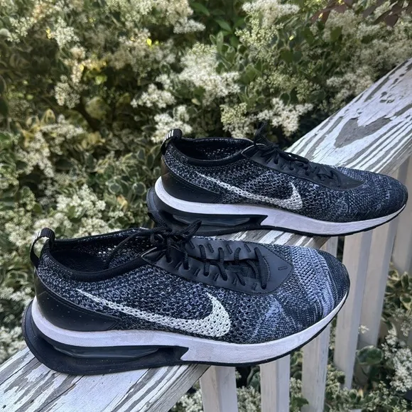 Nike air Flyknit black and white athletic shoes