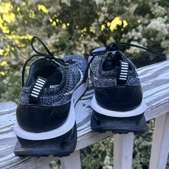 Nike air Flyknit black and white athletic shoes