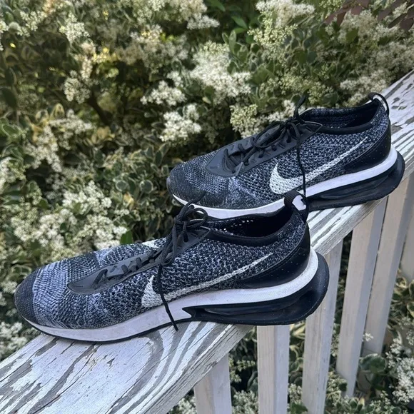 Nike air Flyknit black and white athletic shoes