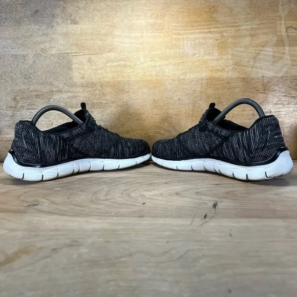 Skechers Empire Womens Size 10 Slip On Running Shoes Sneakers Black White 12815